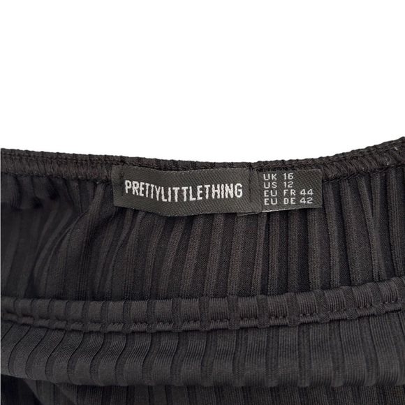 Pretty Little Thing black romper/jumper.
Spaghetti straps size 12 - Picture 3 of 7